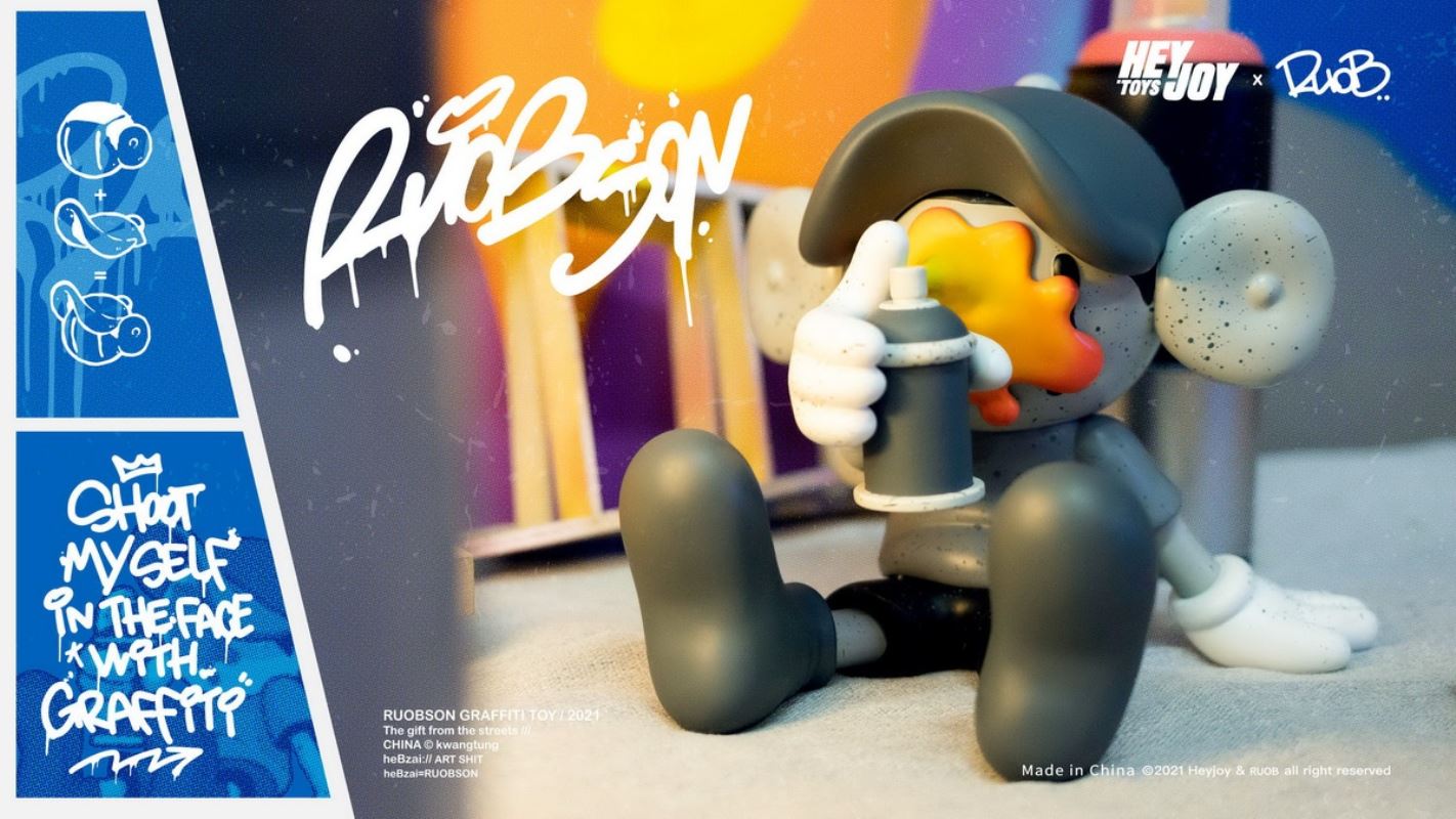 He B shoots his own face with spray paint trendy doll