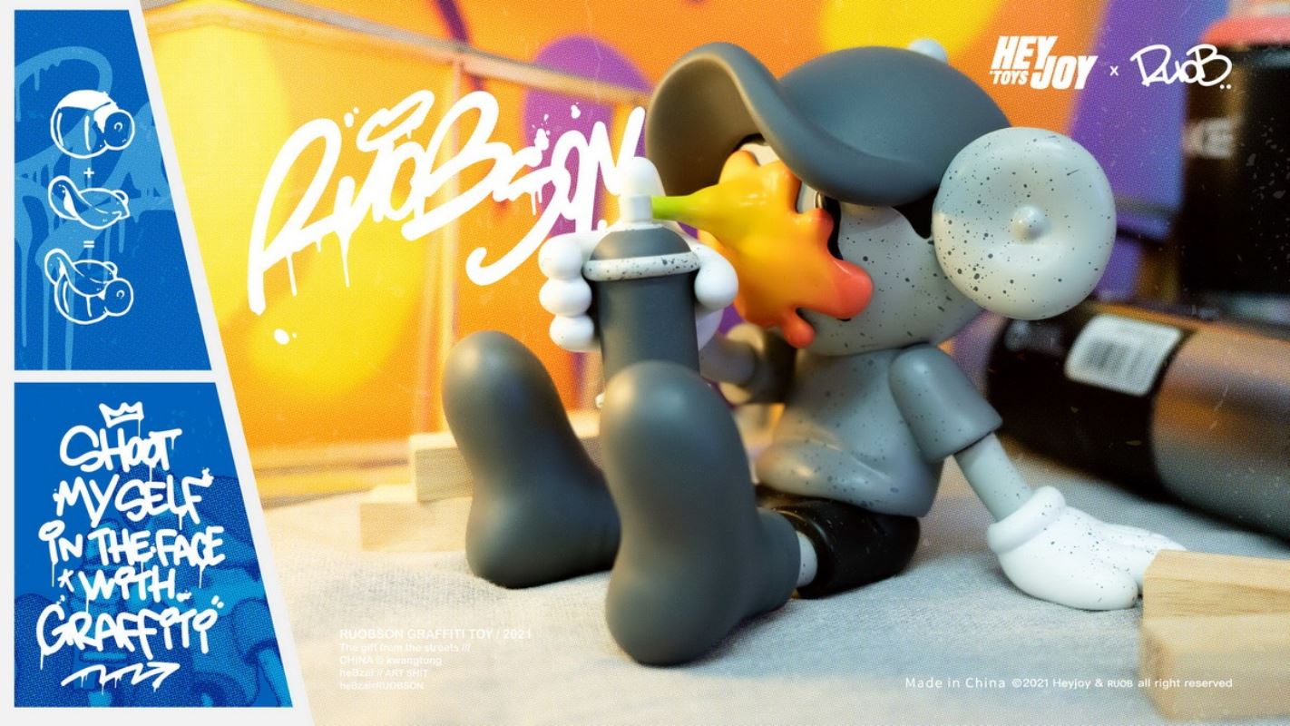 He B shoots his own face with spray paint trendy doll