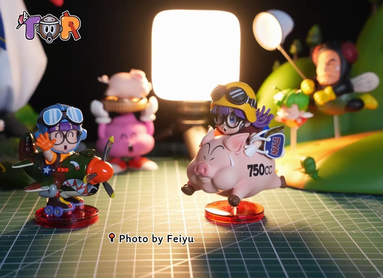 Arale riding a Pig
