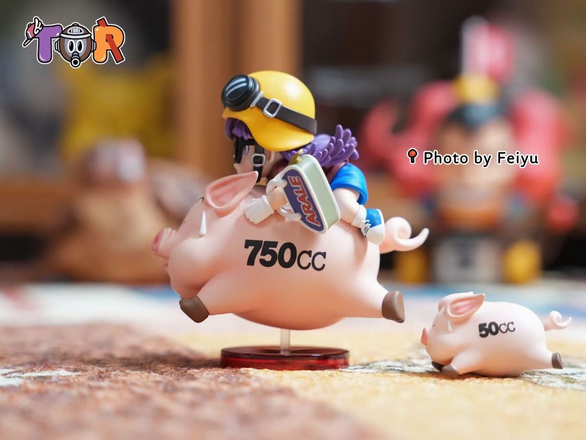 Arale riding a Pig