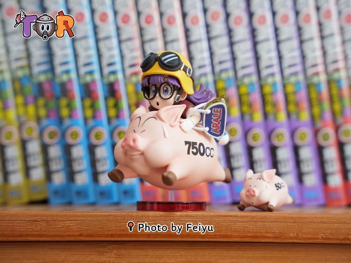 Arale riding a Pig