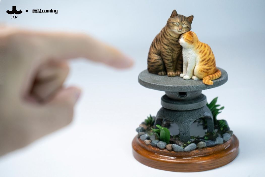 Cats Resting Among Stones