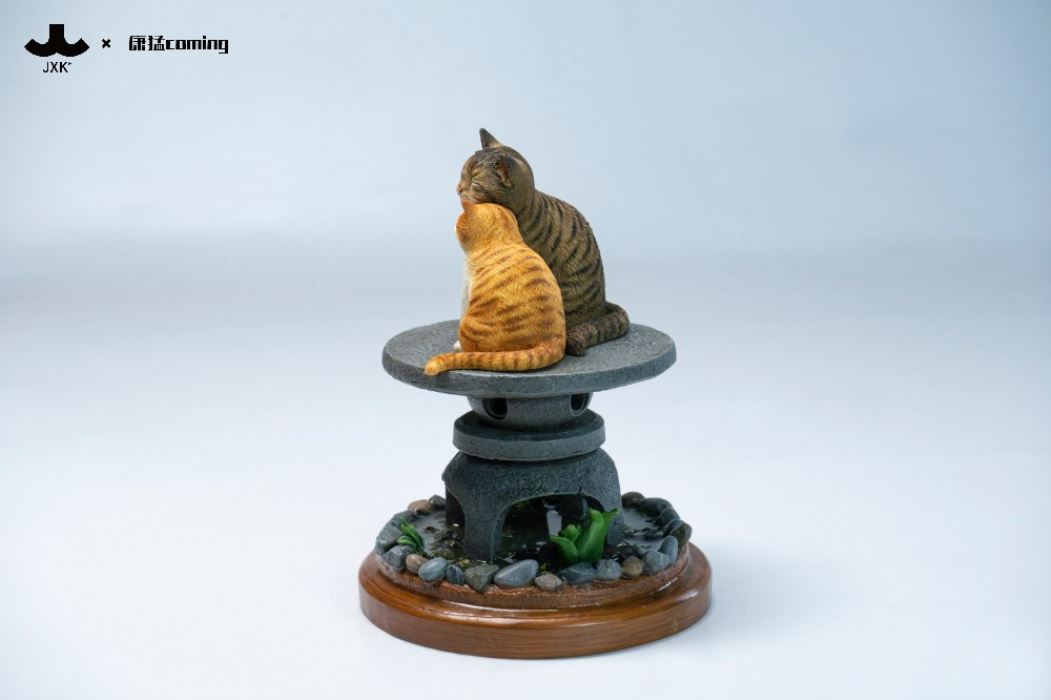 Cats Resting Among Stones