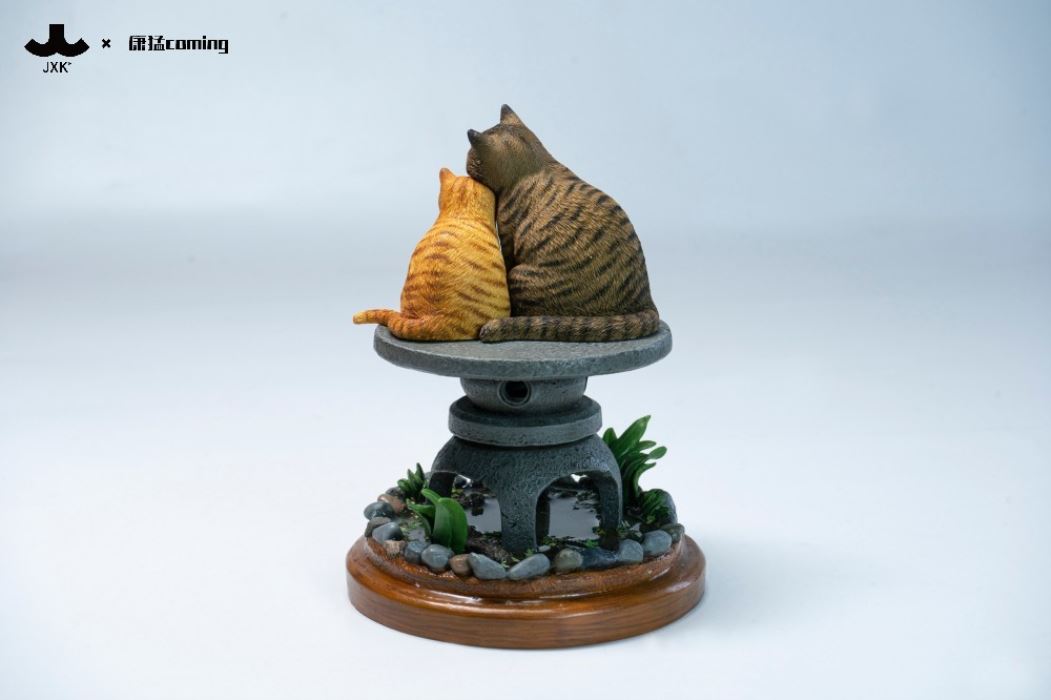 Cats Resting Among Stones